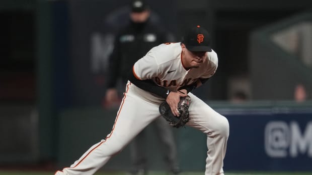 Oct 14, 2021; San Francisco, California, USA; San Francisco Giants first baseman Wilmer Flores (41) fields a ground ball hit by Los Angeles Dodgers center fielder Gavin Lux (not pictured) during the seventh inning in game five of the 2021 NLDS at Oracle Park. Mandatory Credit: Neville E. Guard-USA TODAY Sports